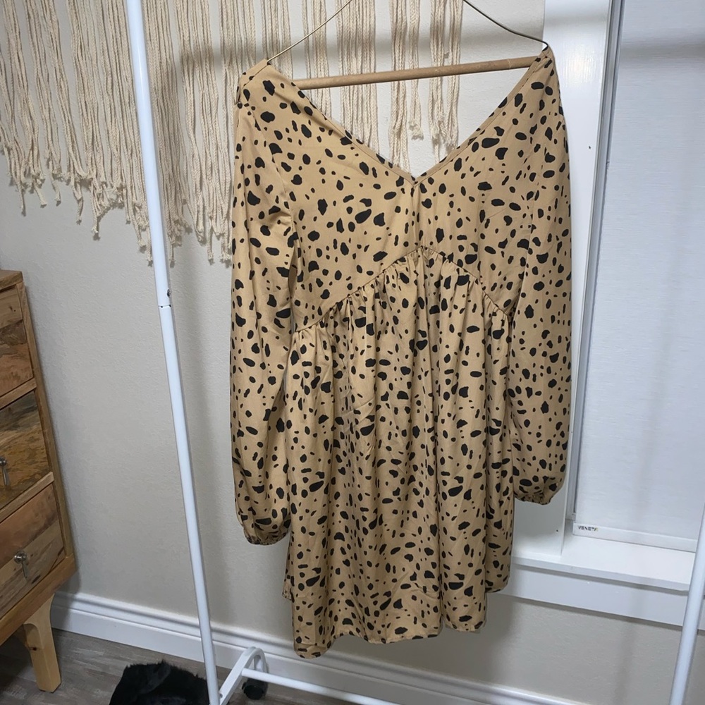 Open backed tan dalmatian print dress size small. Worn once.